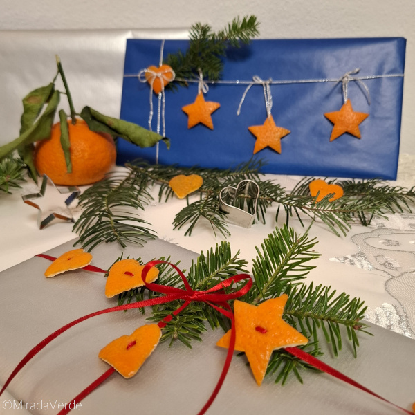 Geschenkeverpackung mit Clementinenschale. Sterne, Herzen